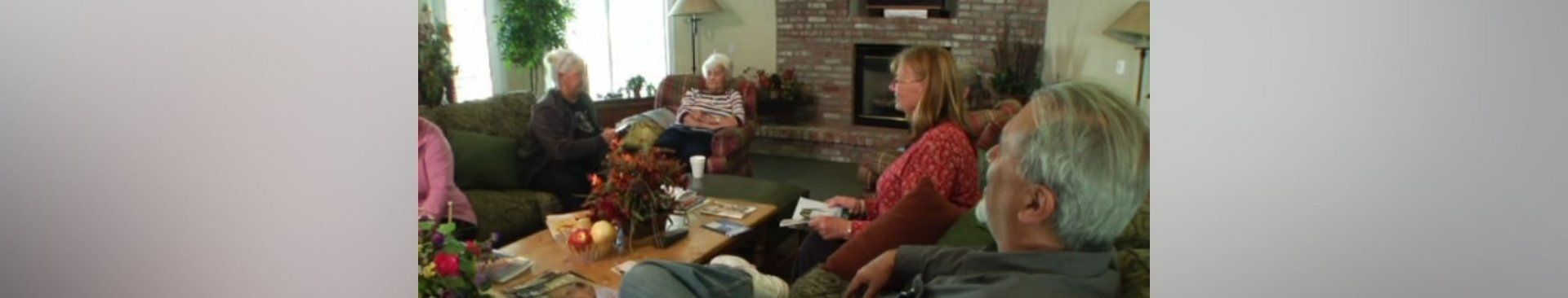 A blurry picture of a group of people in a living room