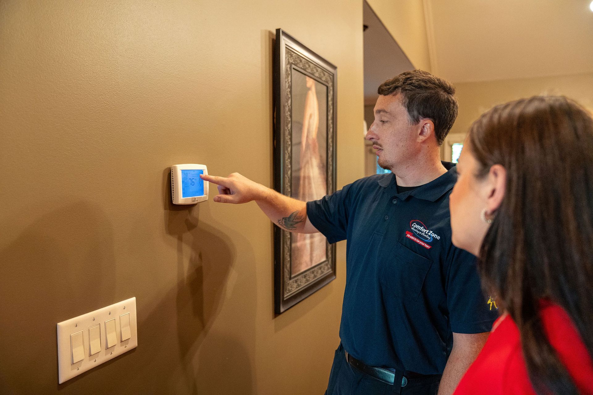 Logo for Comfort Zone Heating, Cooling, and Plumbing with the tagline, 