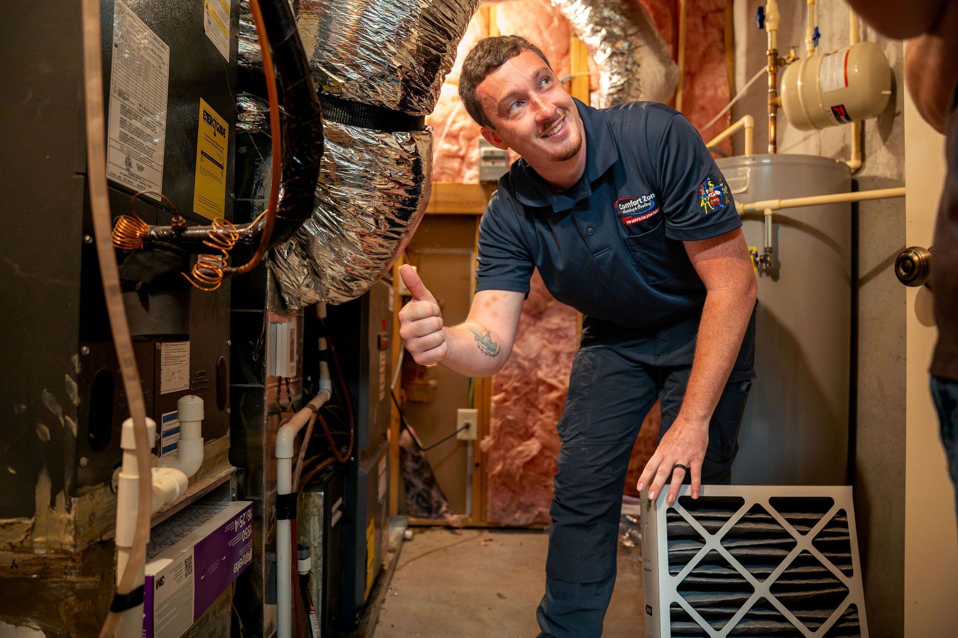 Logo for Comfort Zone Heating, Cooling, and Plumbing with the tagline,