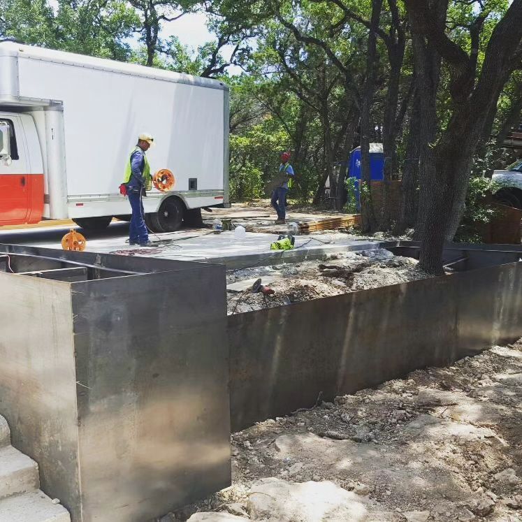 A construction site with a white truck in the background.