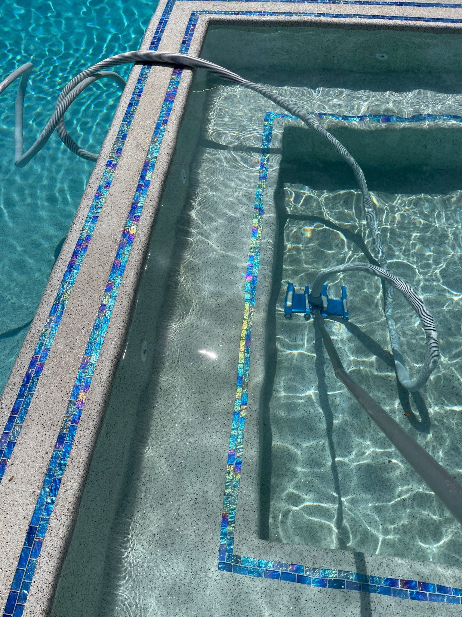 swimming pool with vacuum tube cleaner
