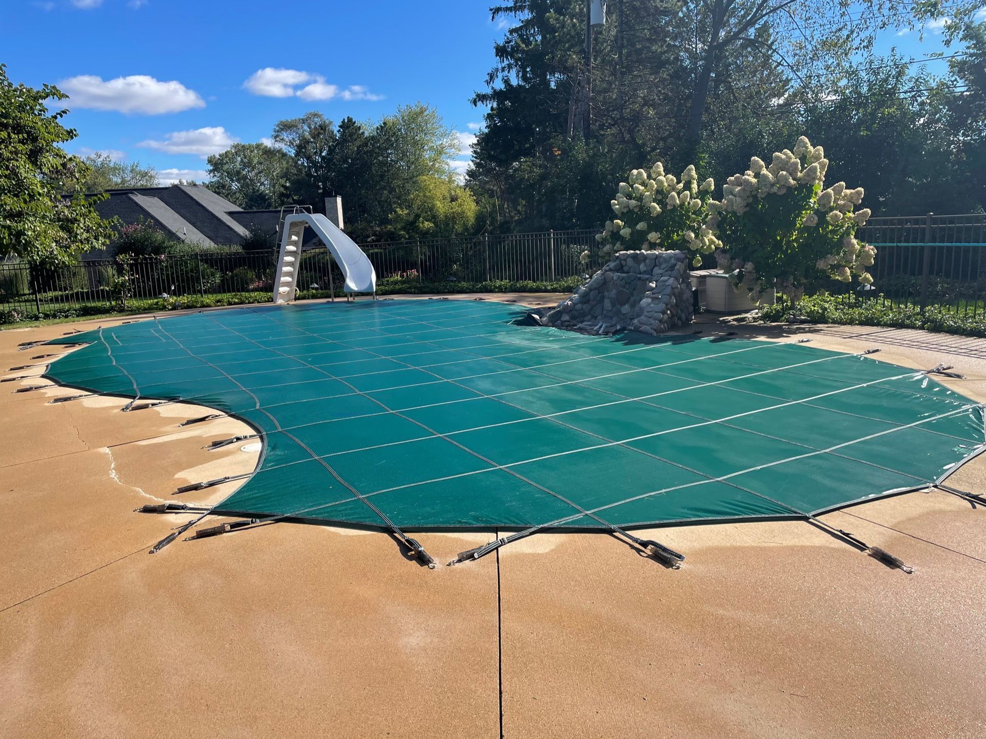 Bubble wrap pool cover pulled over a swimming pool
