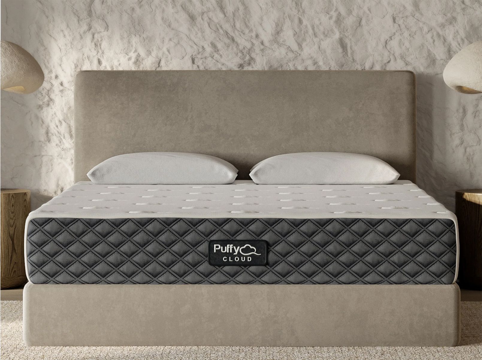 Gray and white patterned mattress on beige bed frame, headboard, and pillows. Neutral-toned room setting.