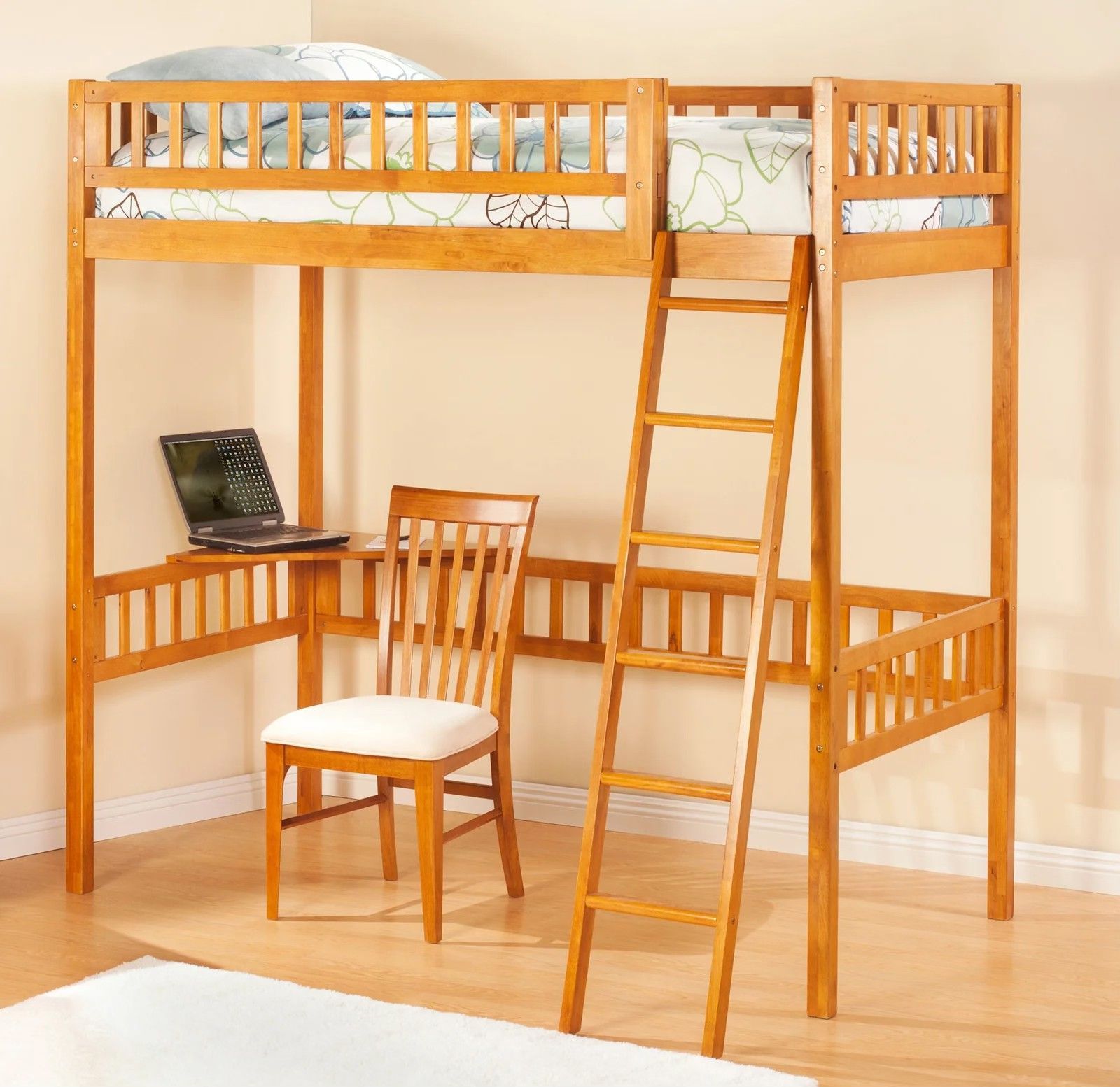 Wooden loft bed with desk and chair. Laptop on desk, ladder to bed. Bright room with rug.