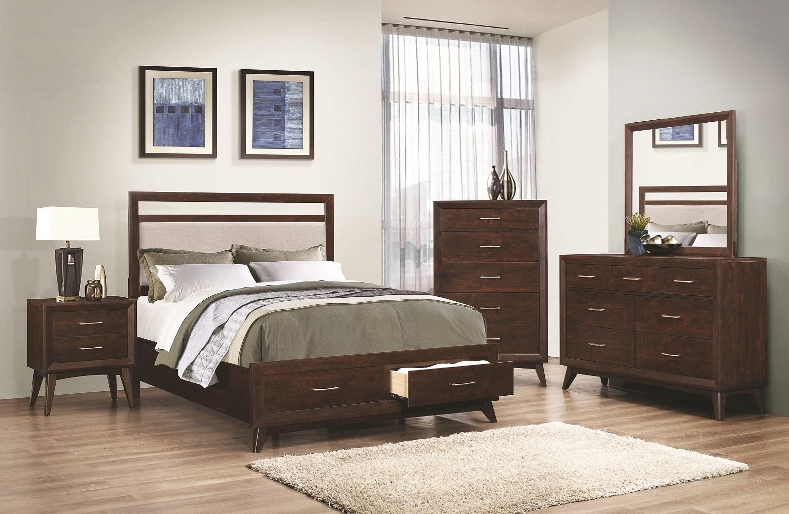 Bedroom furniture set: bed, nightstand, chest, dresser, mirror, in wood finish.