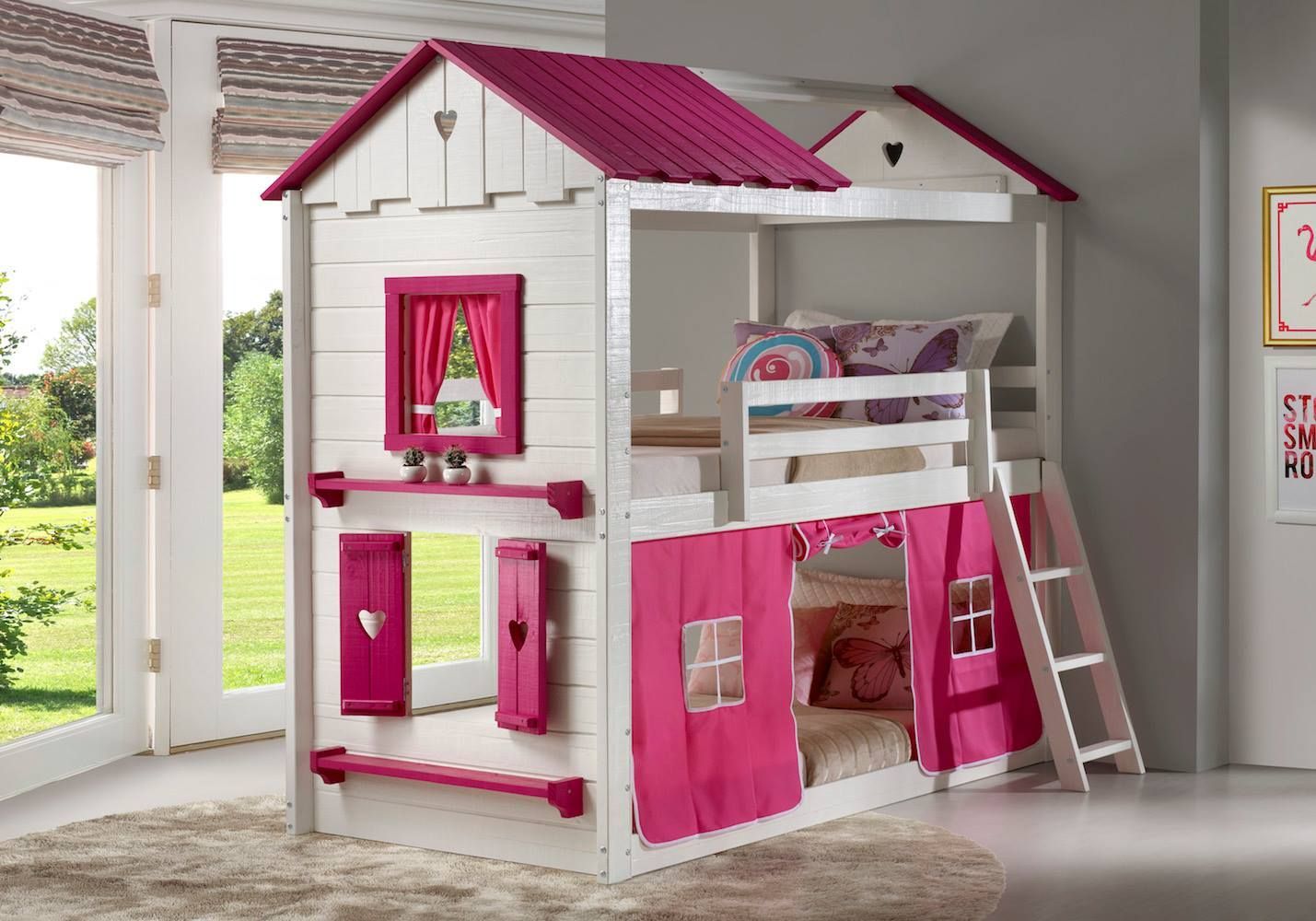 White and pink house-shaped bunk bed in a sunny room with curtains.
