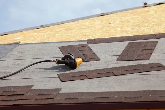 A power tool is on top of a roof
