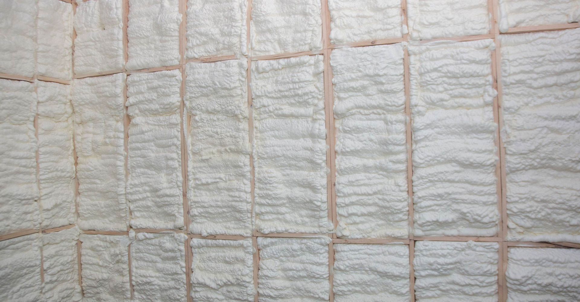 A close-up of a wall with foam insulation on it