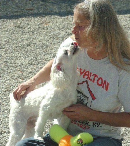 Woman playing with the dog