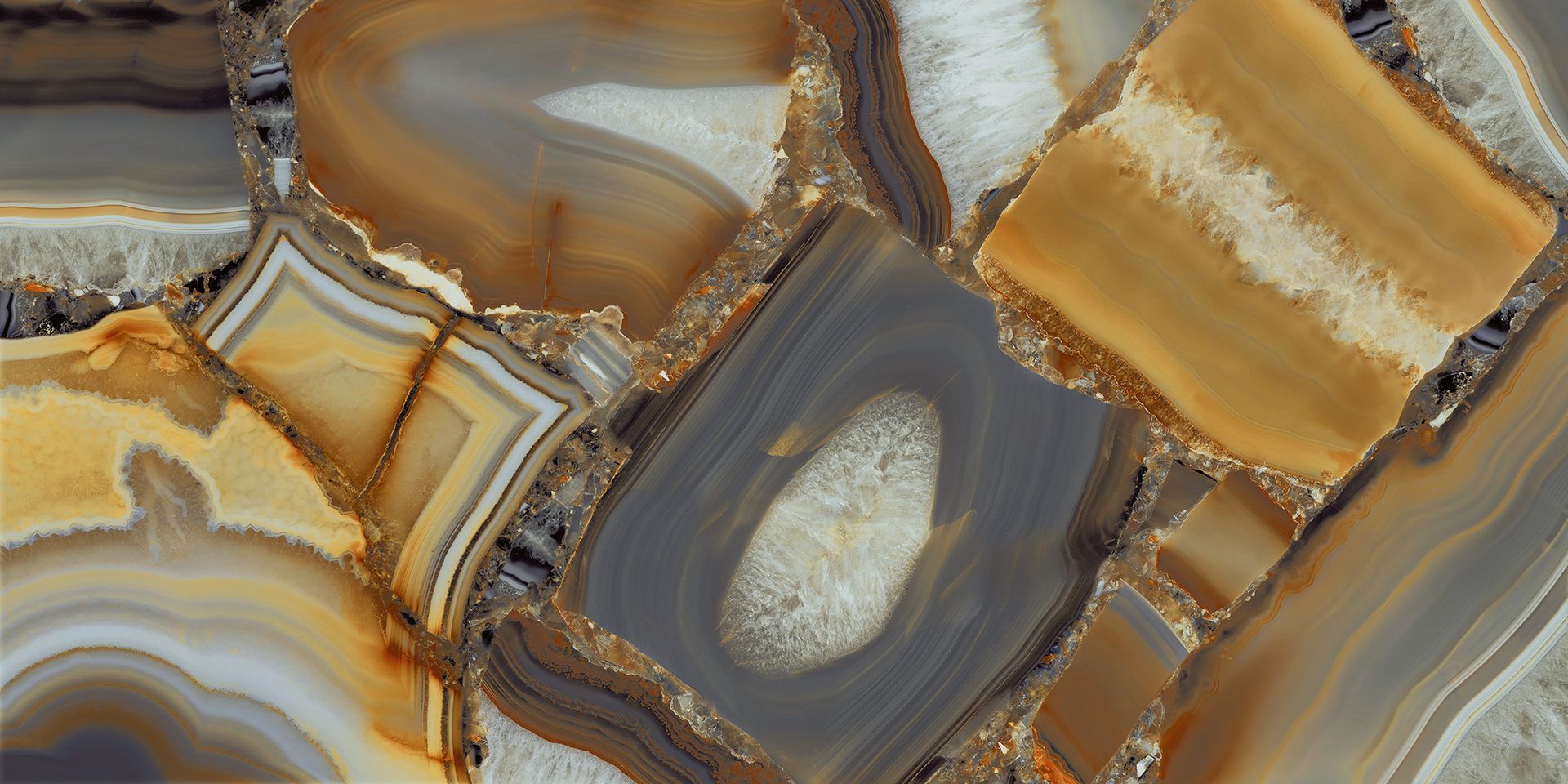 Abstract close-up of polished brown, gray, and gold stone slices with crystalline textures