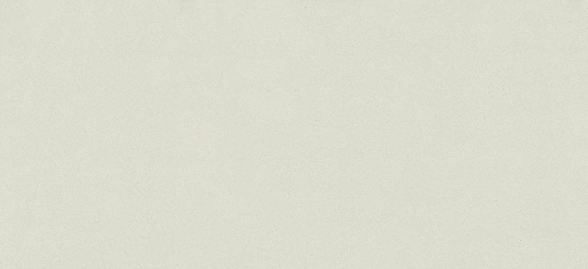 Blank light beige textured surface with subtle speckles and a soft shadow across the top left