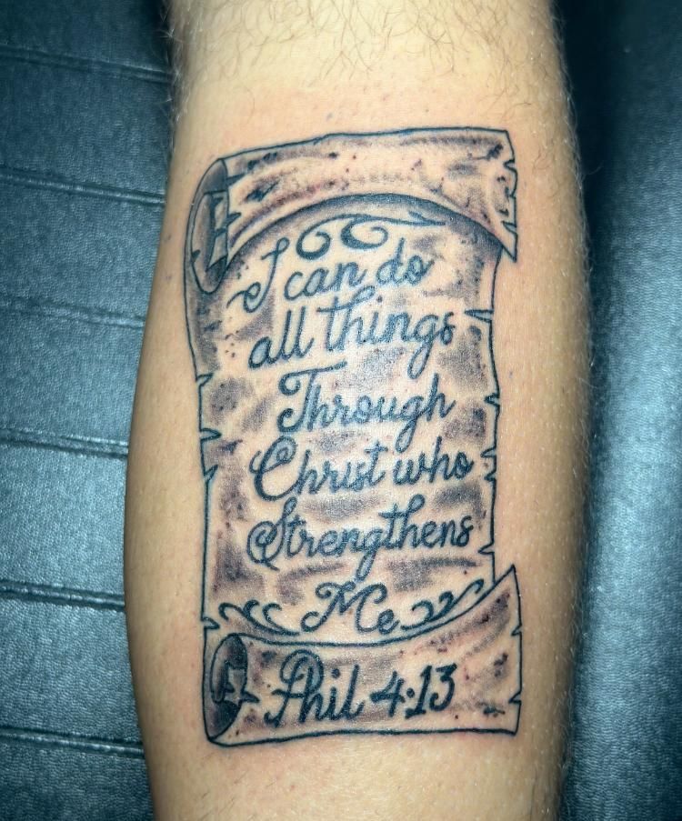 A tattoo of a scroll that says i can do all things through christ who strengthens me