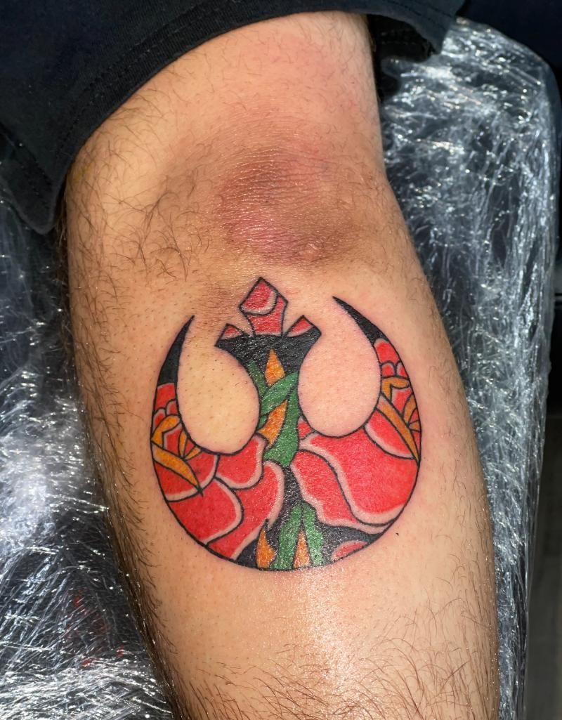 A man has a star wars tattoo on his leg