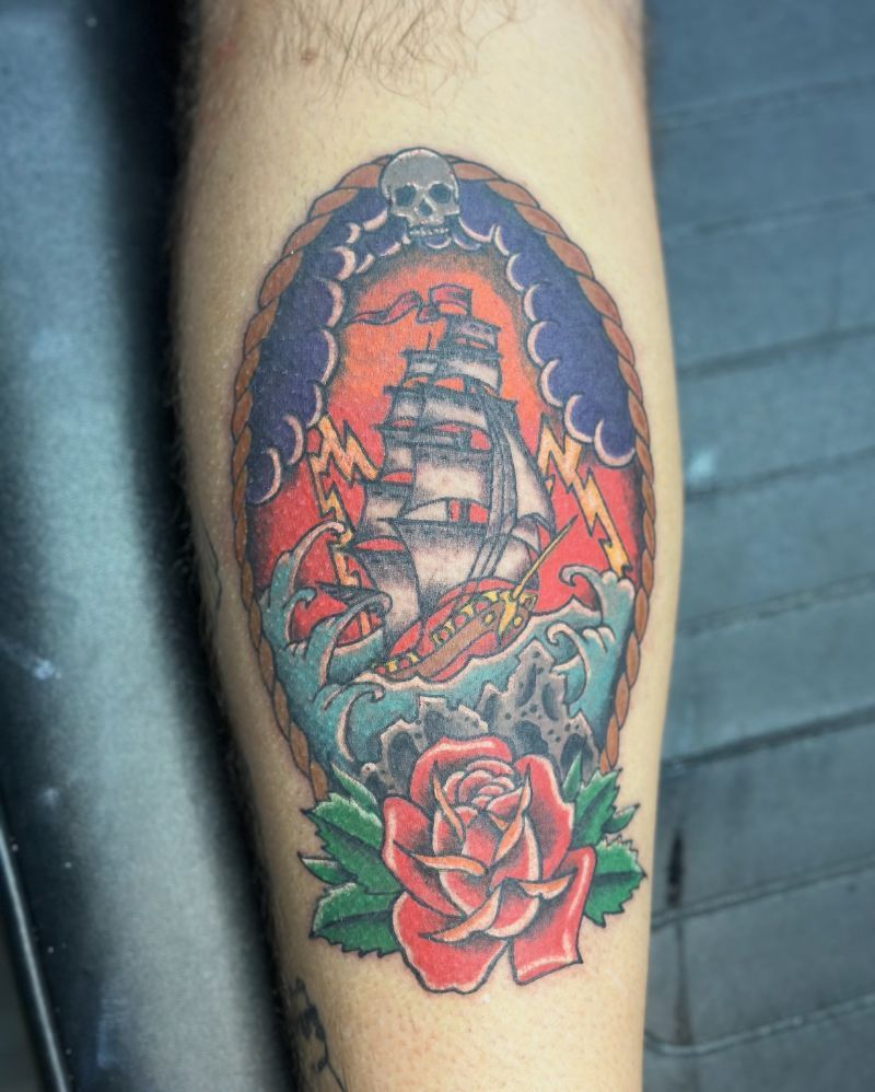 A tattoo of a ship and a rose on a leg