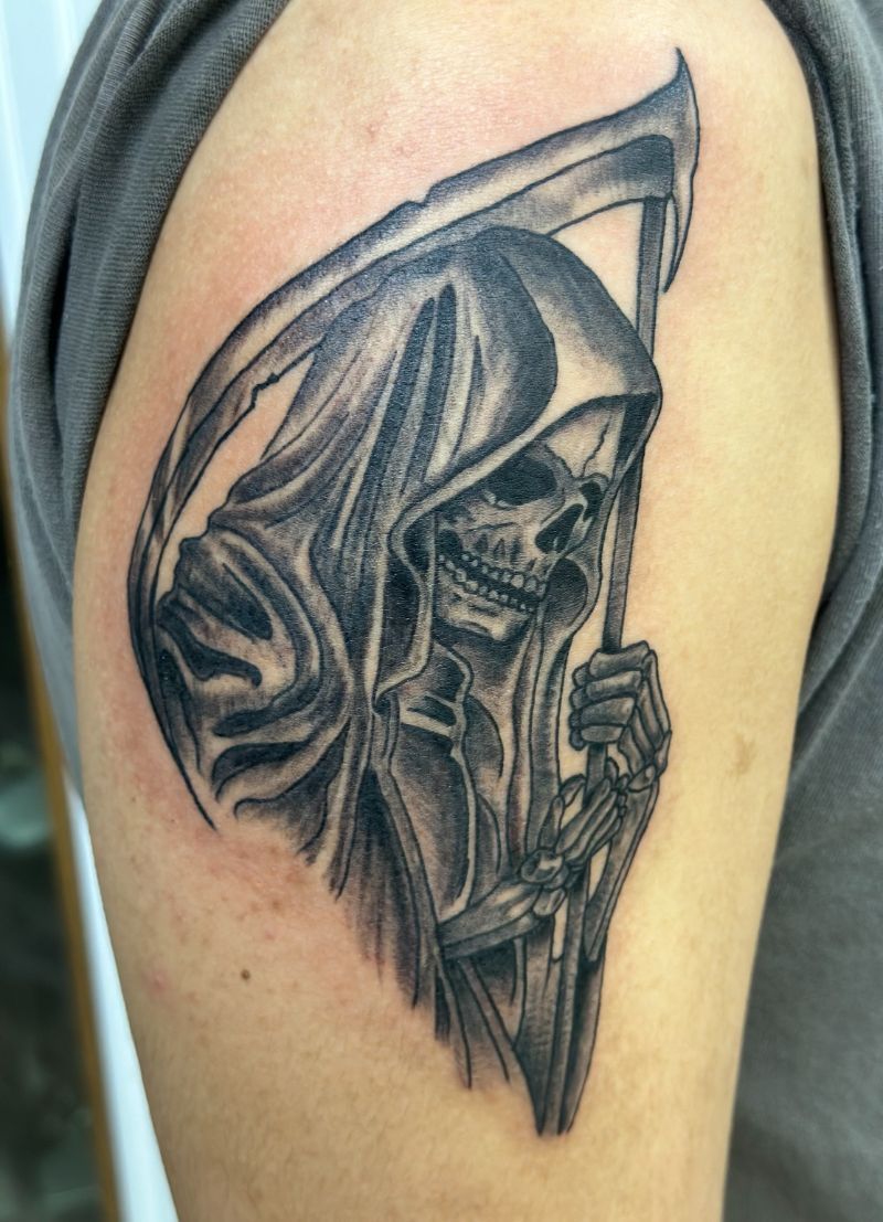 A grim reaper tattoo on a person 's arm