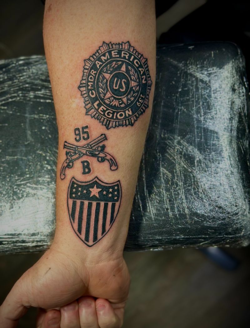 A person has a tattoo on their arm that says us legion