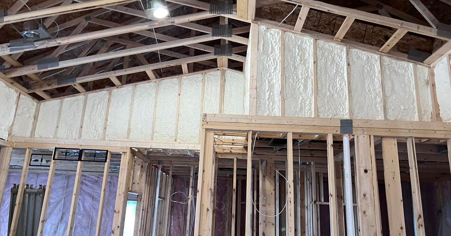 A house is being built with a lot of insulation on the walls.