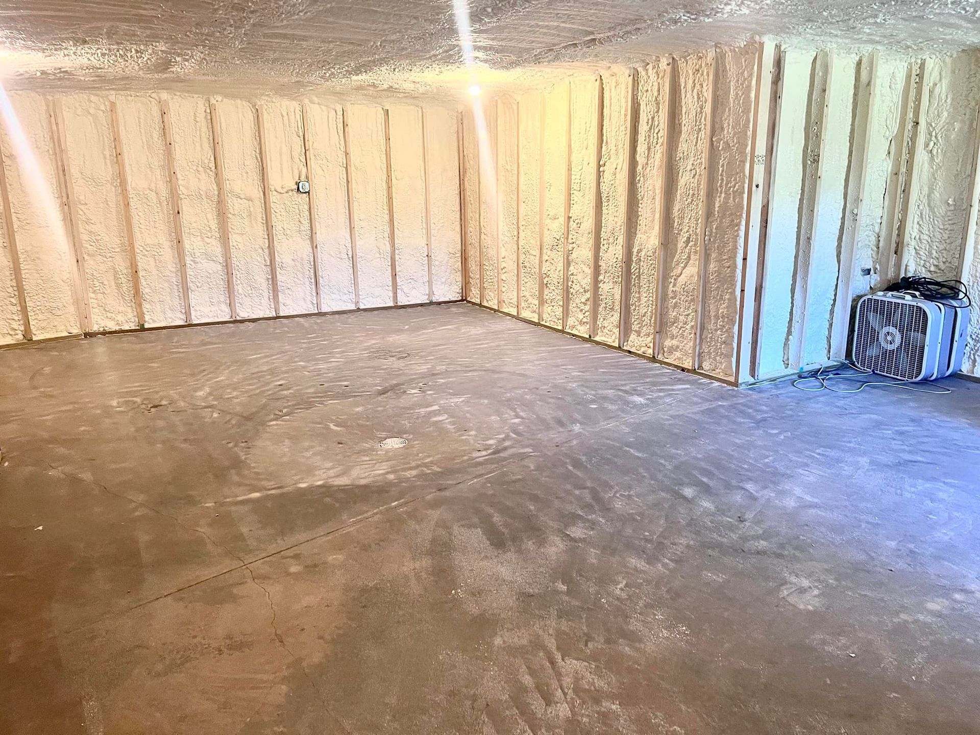 A room with a lot of foam on the walls and a concrete floor.