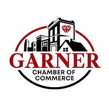Garner Chamber of Commerce logo featuring buildings, a diamond, and text in red and black within a circular frame.