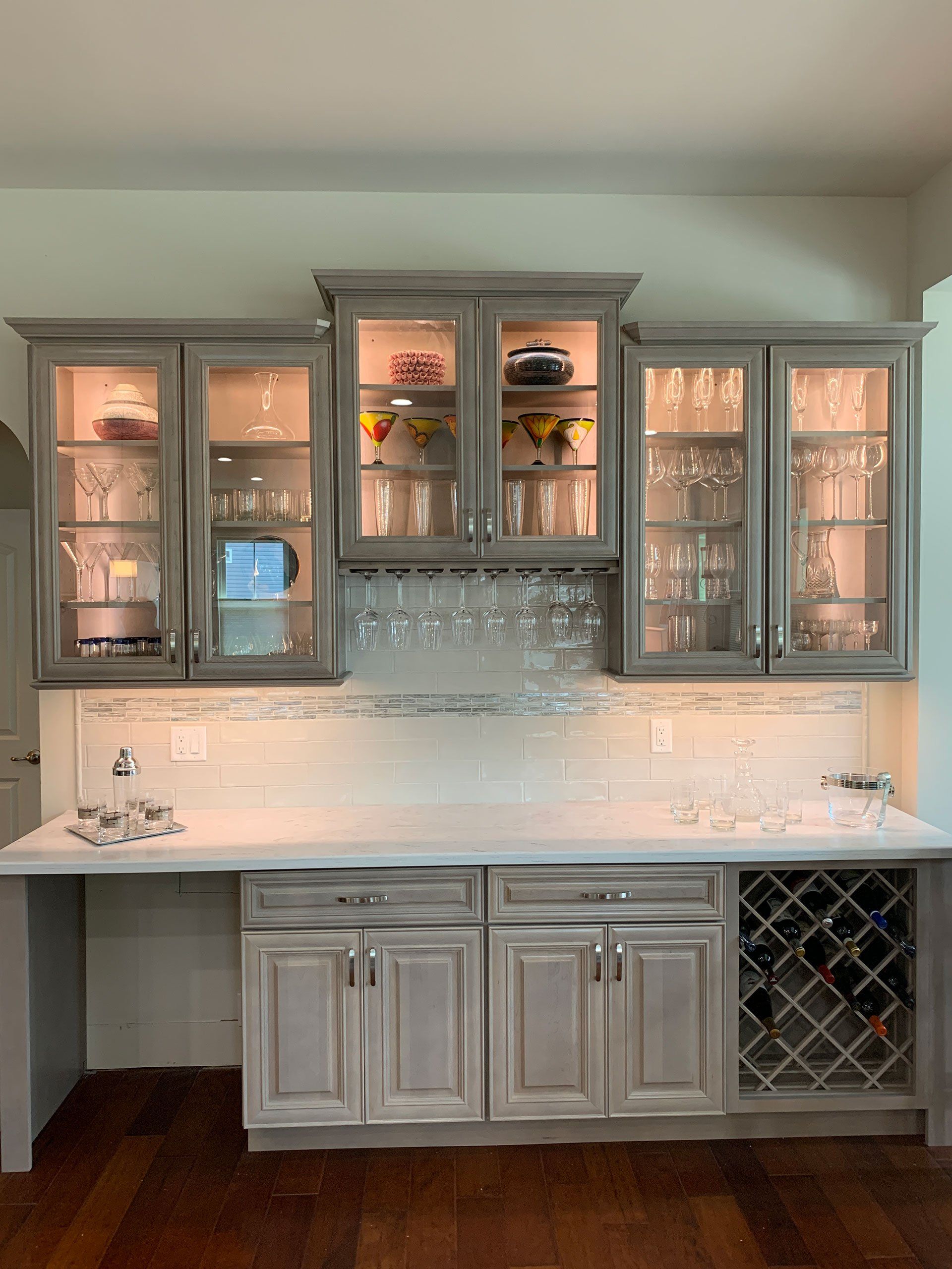 Designers Choice cabinetry in London Fog stain, Corian countertops in Limestone Prima