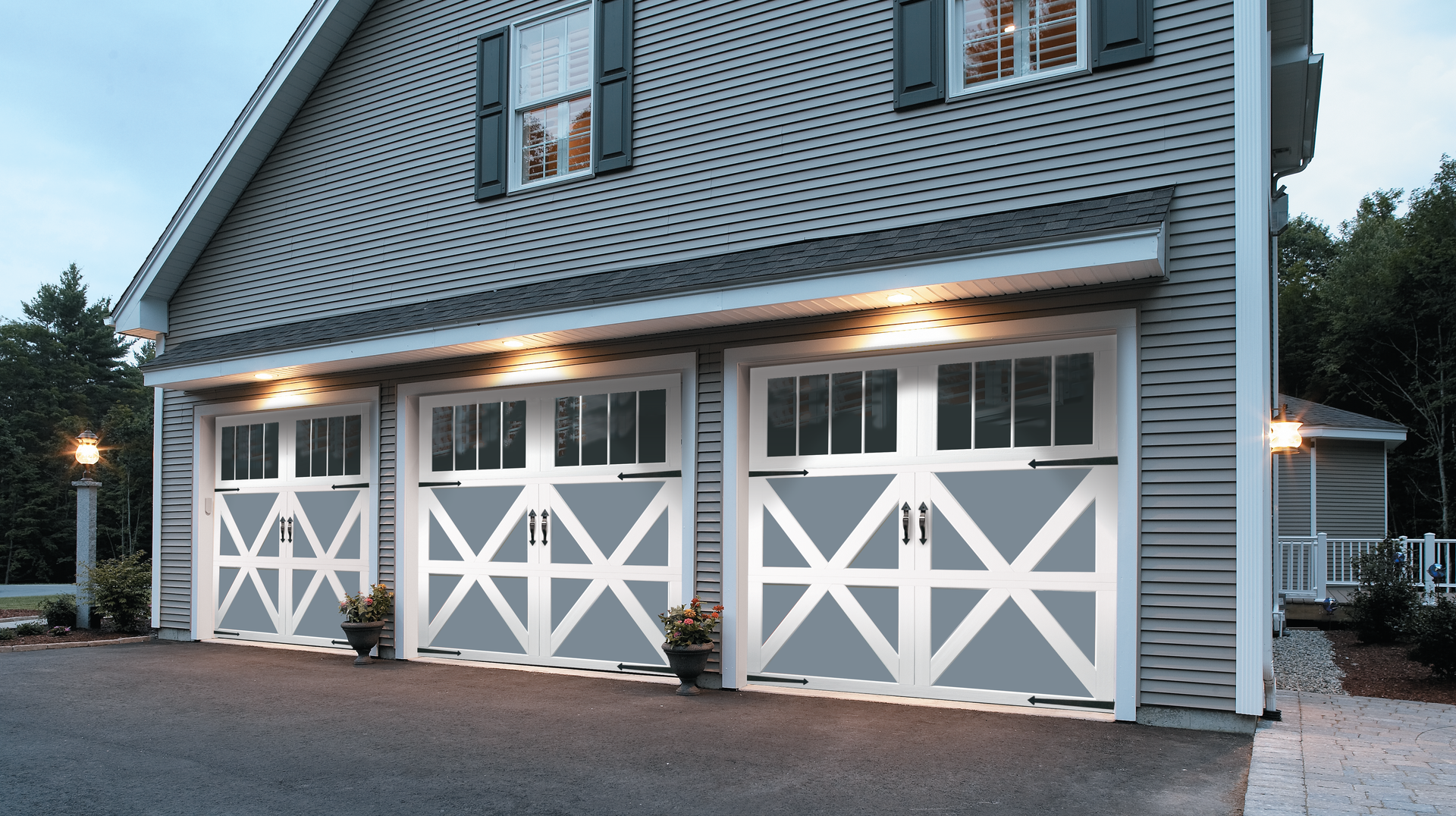 A house with three garage doors on the side of it