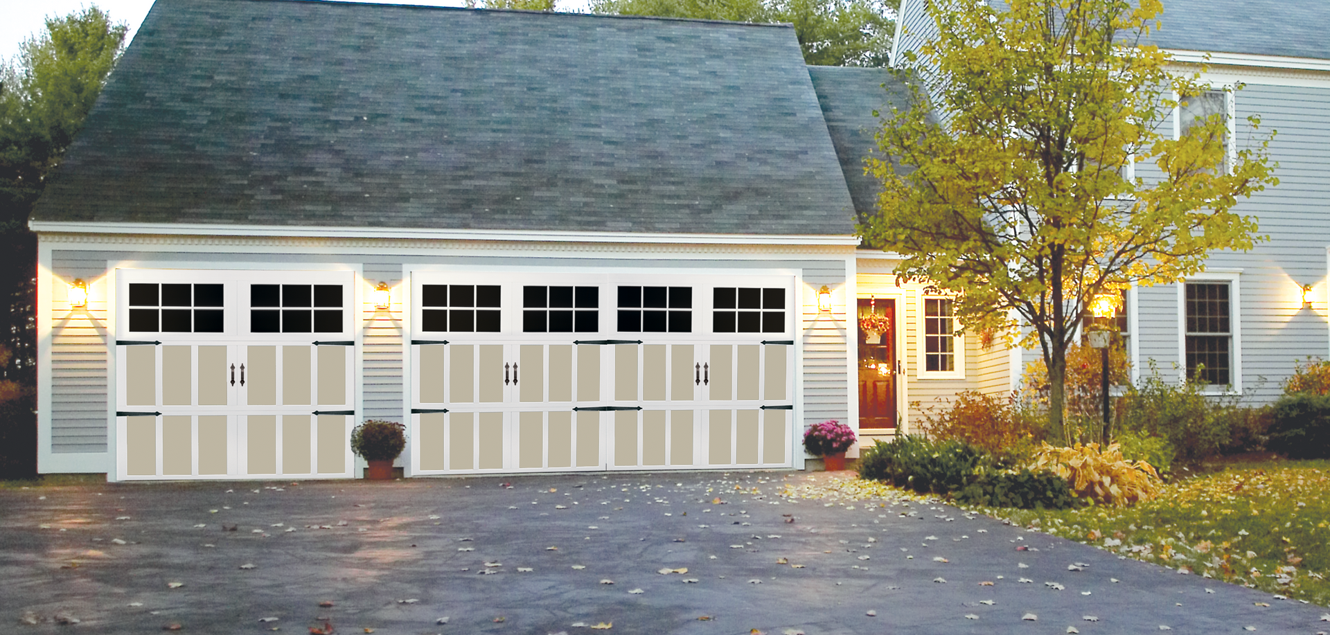 A house with three garage doors and a driveway