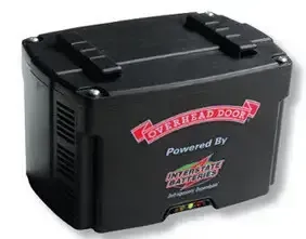 A black box that says overhead door powered by interstate batteries