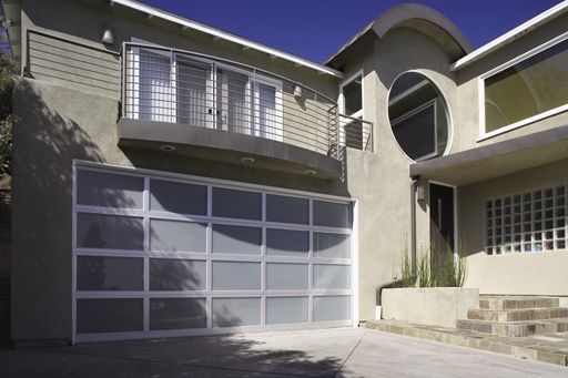 A modern house with a large garage door