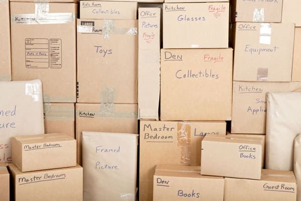 Cardboard moving boxes, labeled 