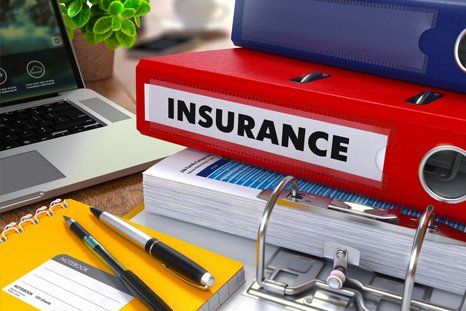 Insurance binders with office supplies