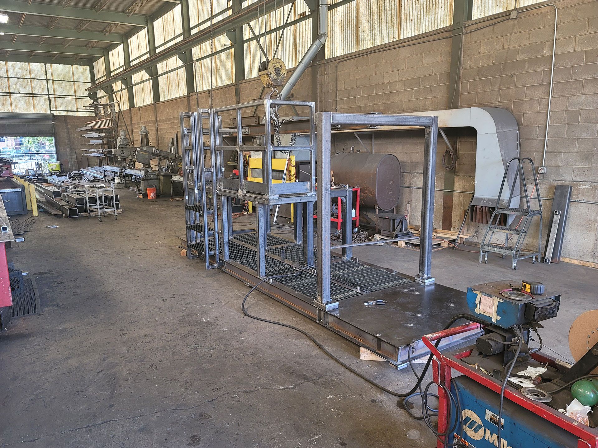 A large warehouse with a lot of machinery in it