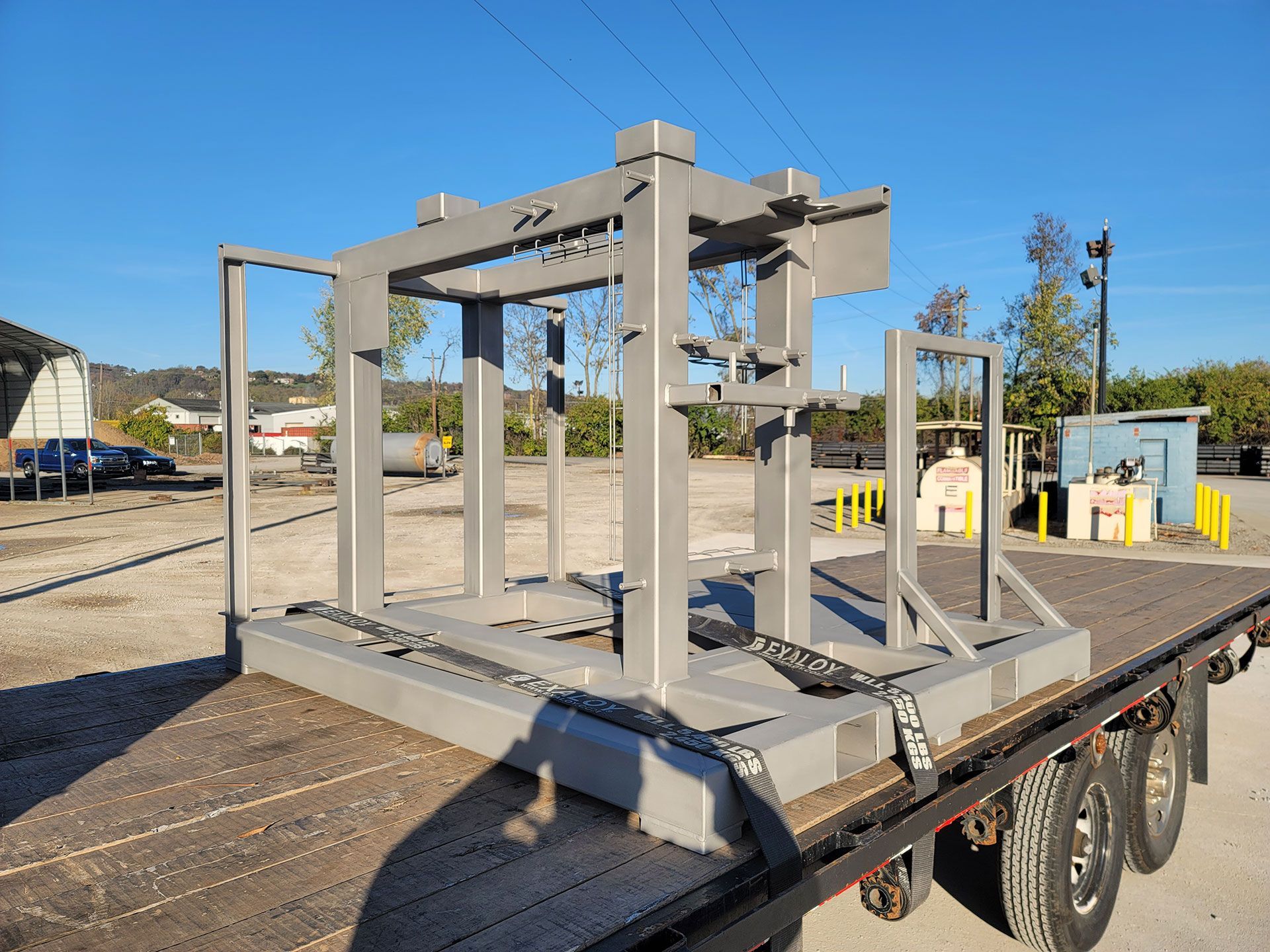 A large metal structure is sitting on top of a trailer.