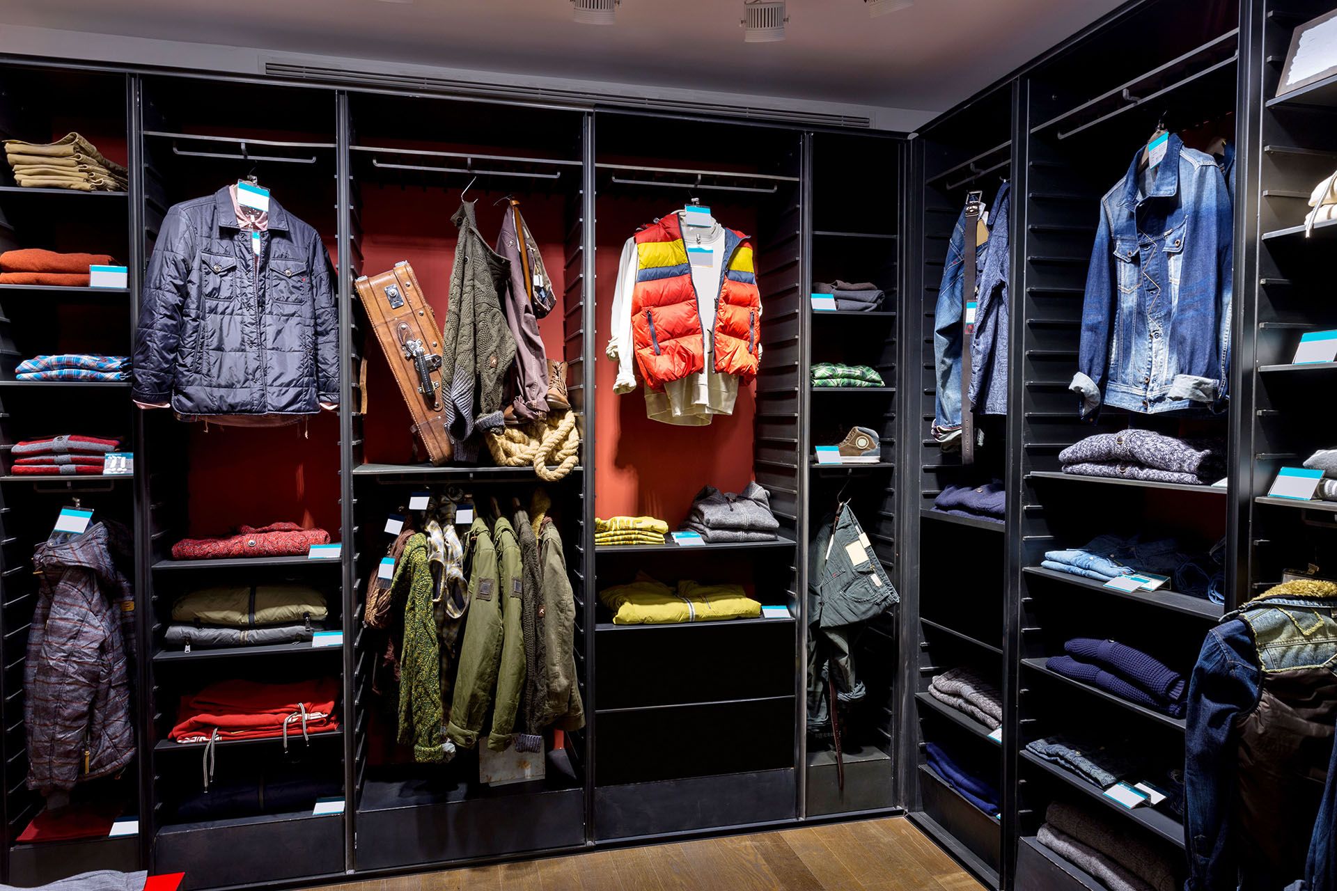 A store filled with lots of clothing, including jackets.