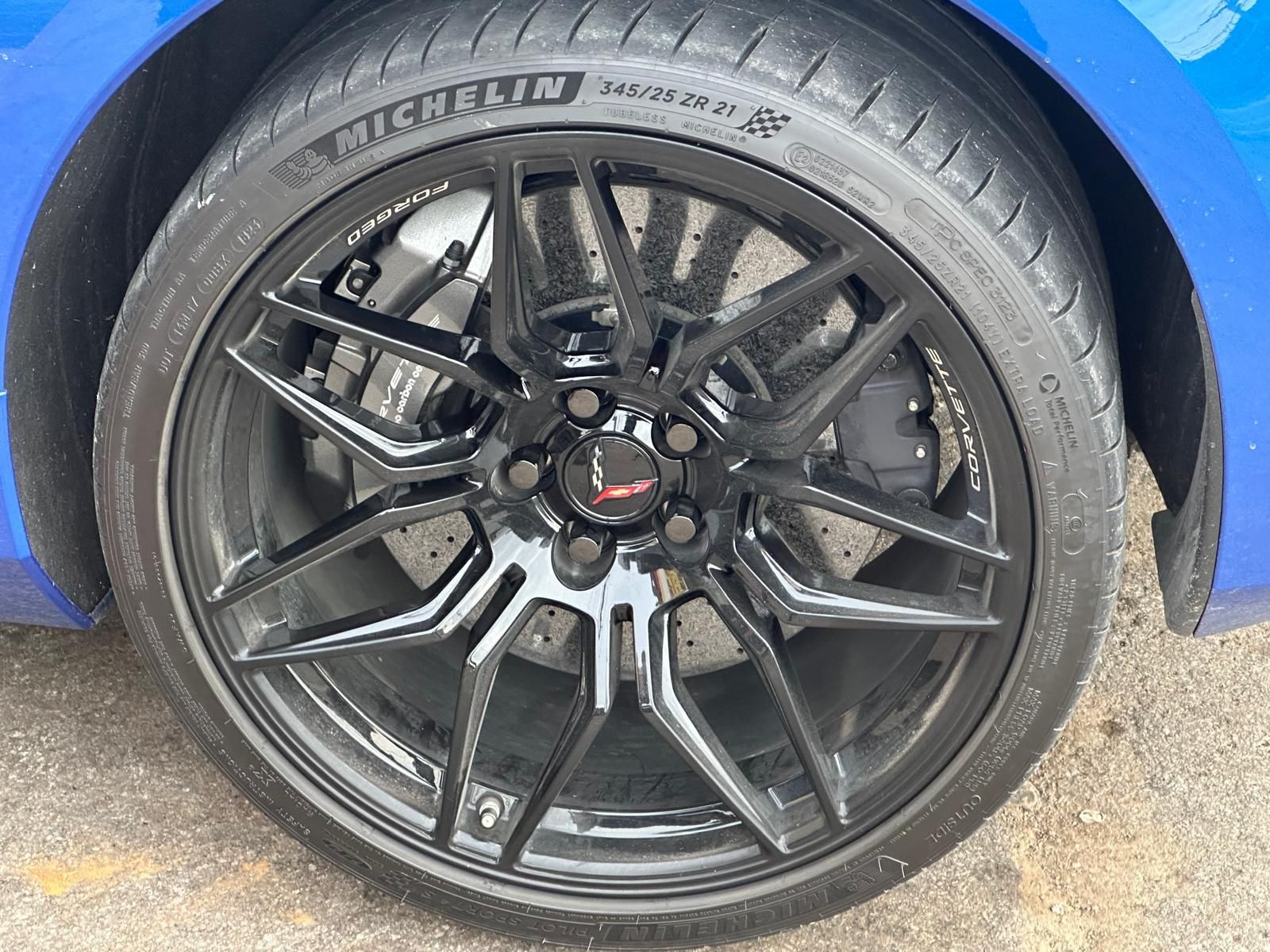 A close up of a car wheel with a tire on it.