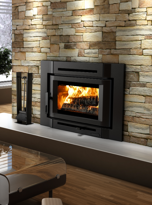 Modern fireplace with a bright fire set in a stone wall beside a living room seating area