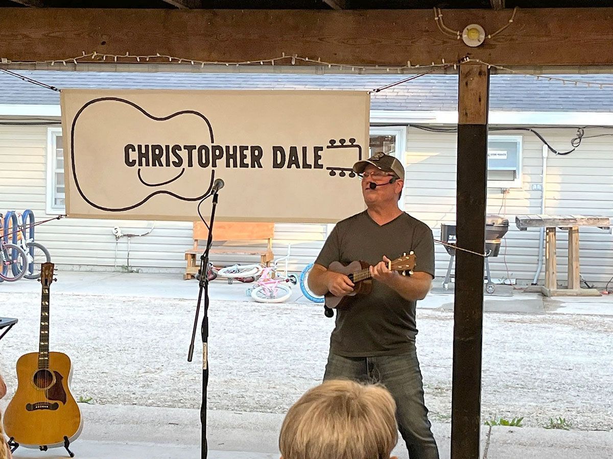 Man playing ukulele on stage