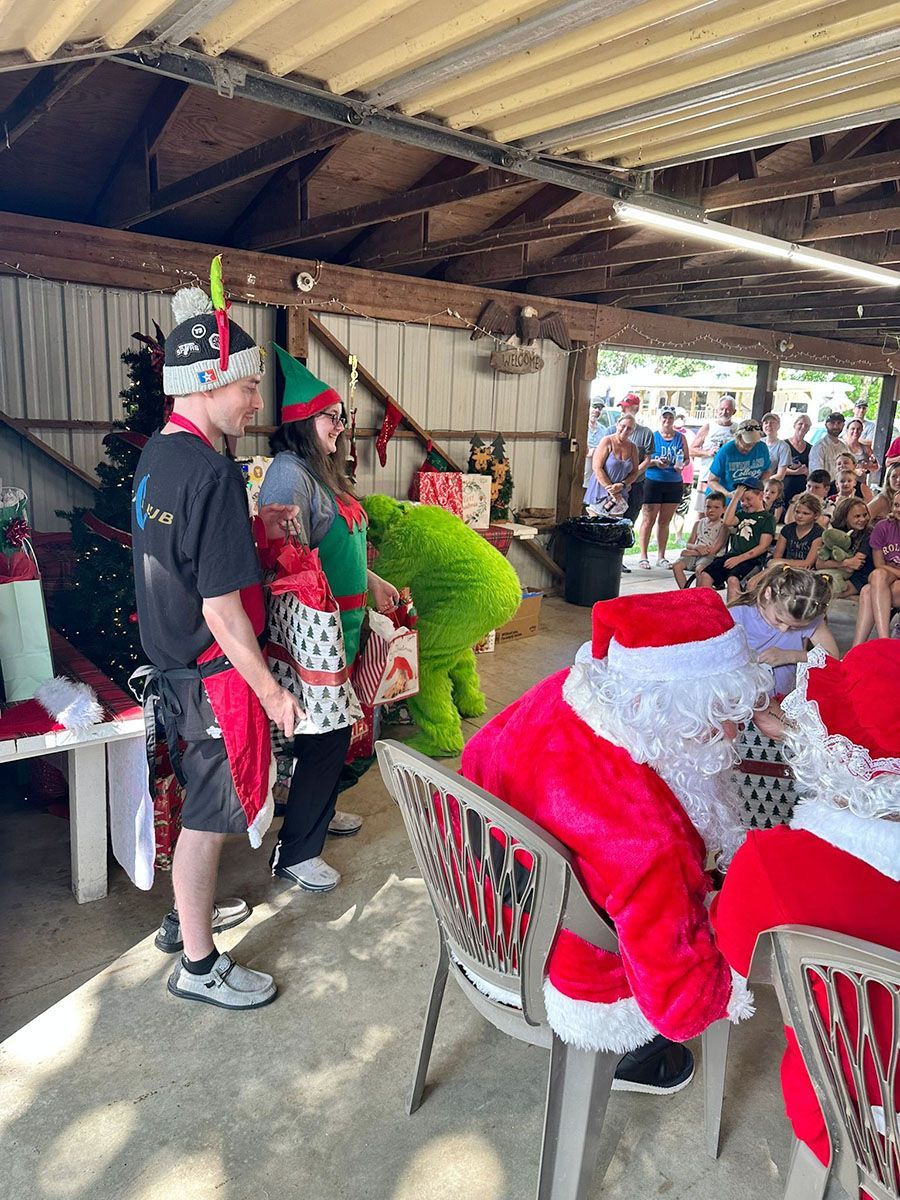 People in Christmas costumes at an outdoor event