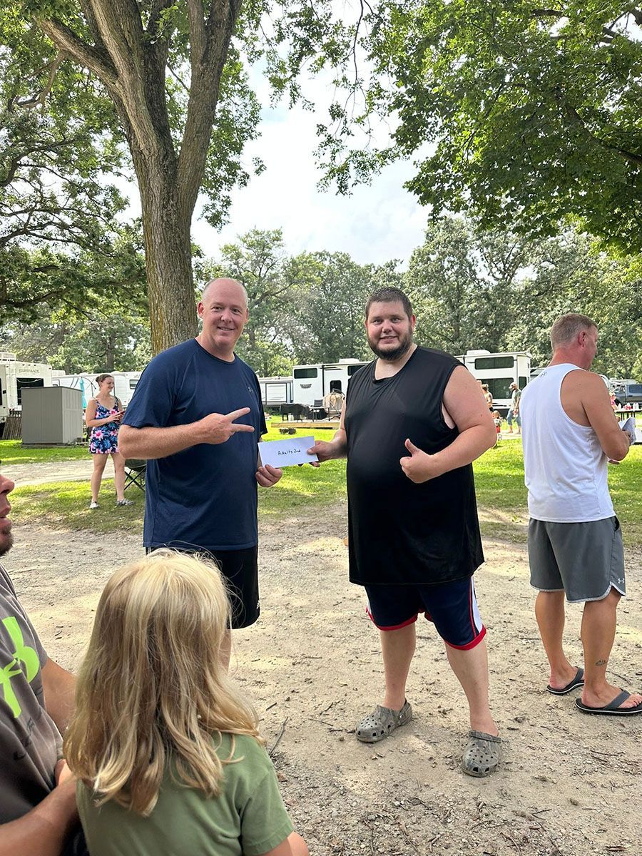 2 man holding a piece of paper