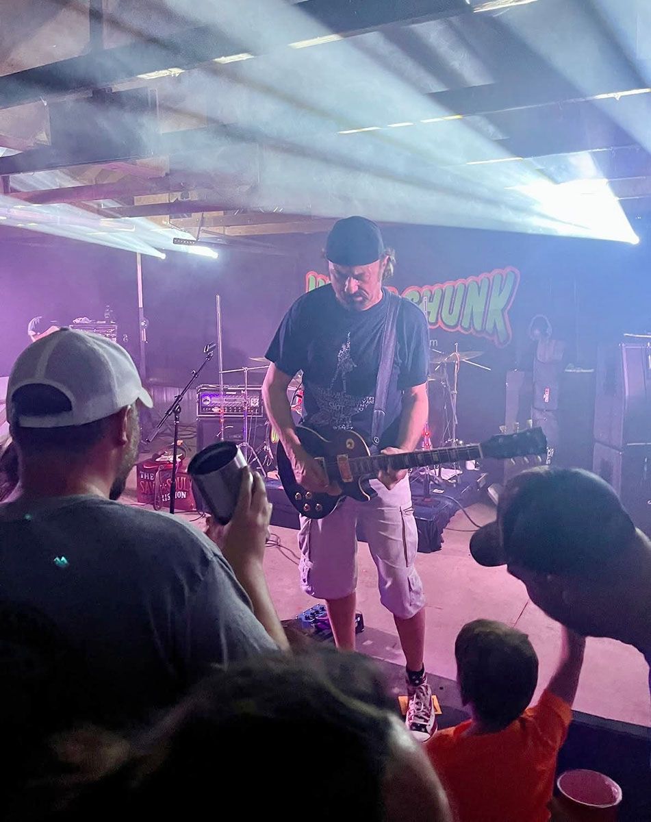 Man playing guitar onstage