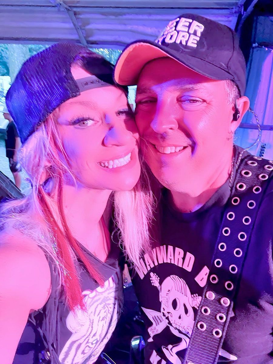 Woman and man smile for a selfie