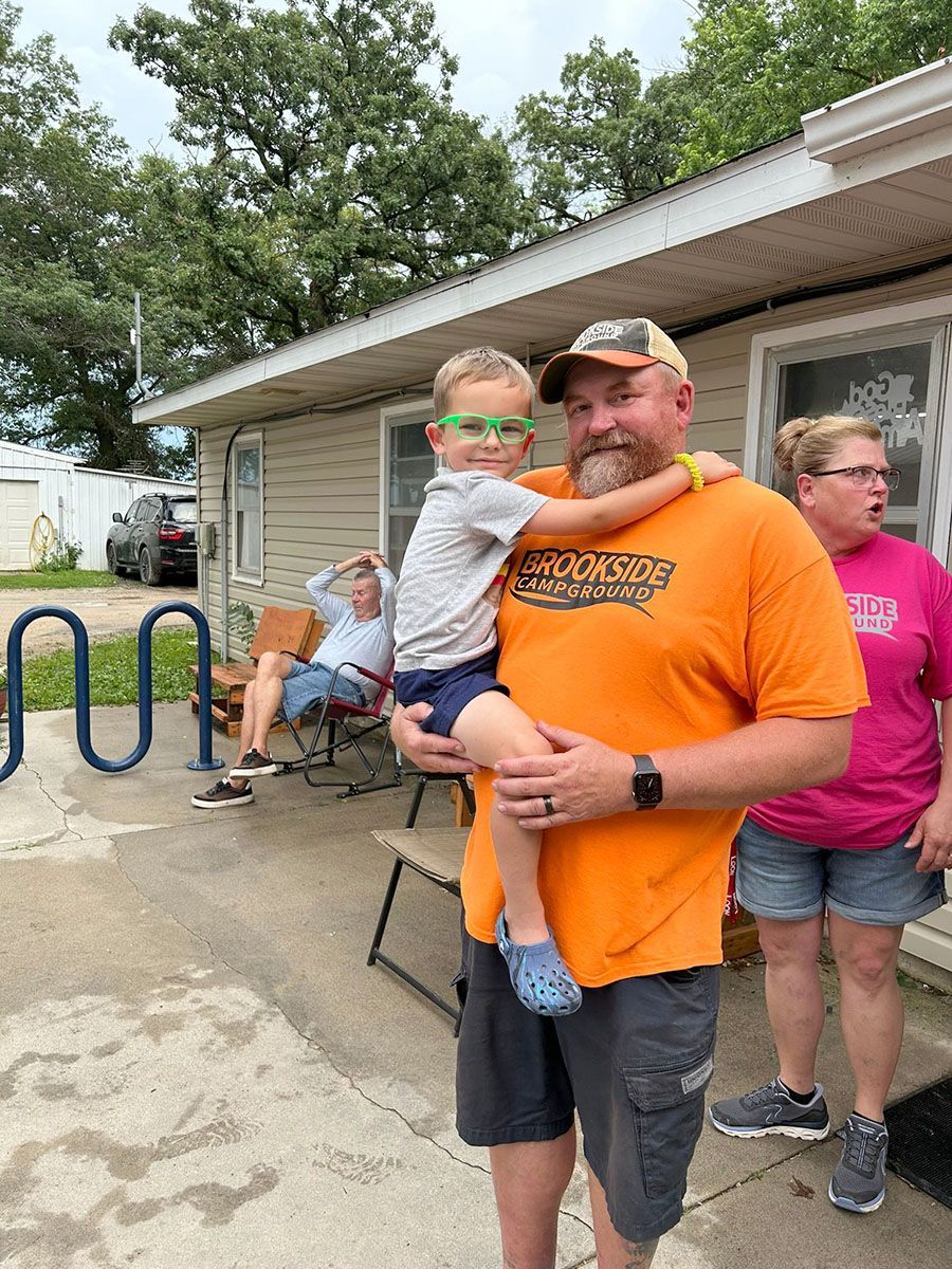 Man holding child wearing glasses