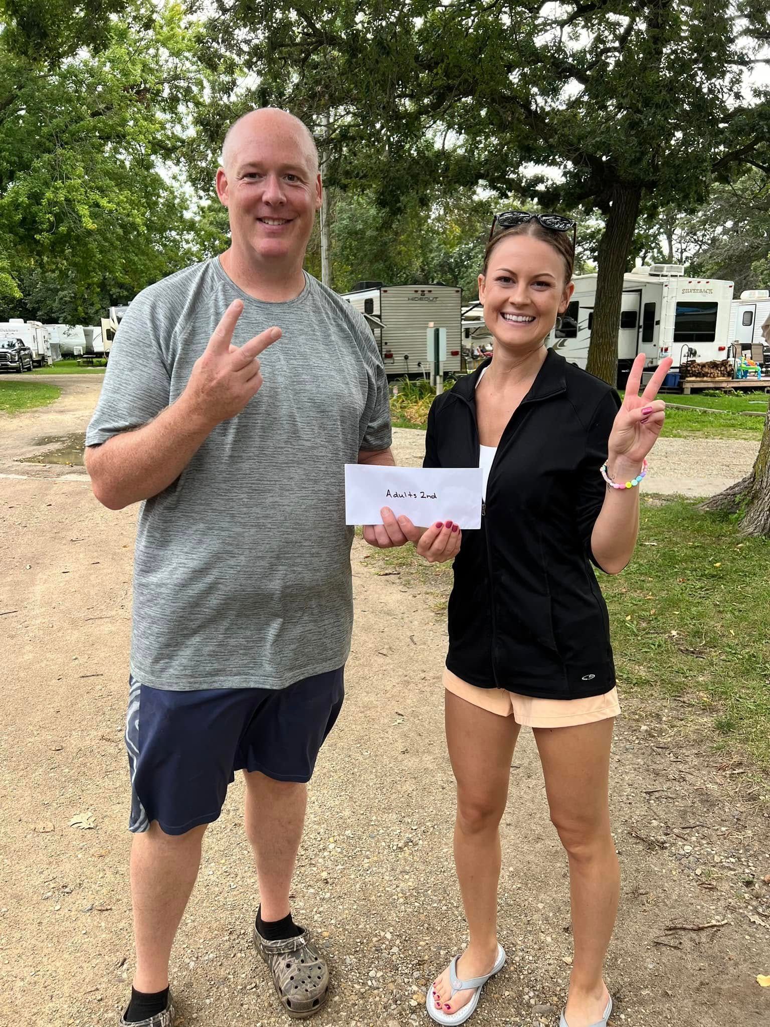 A man and a woman are standing next to each other.
