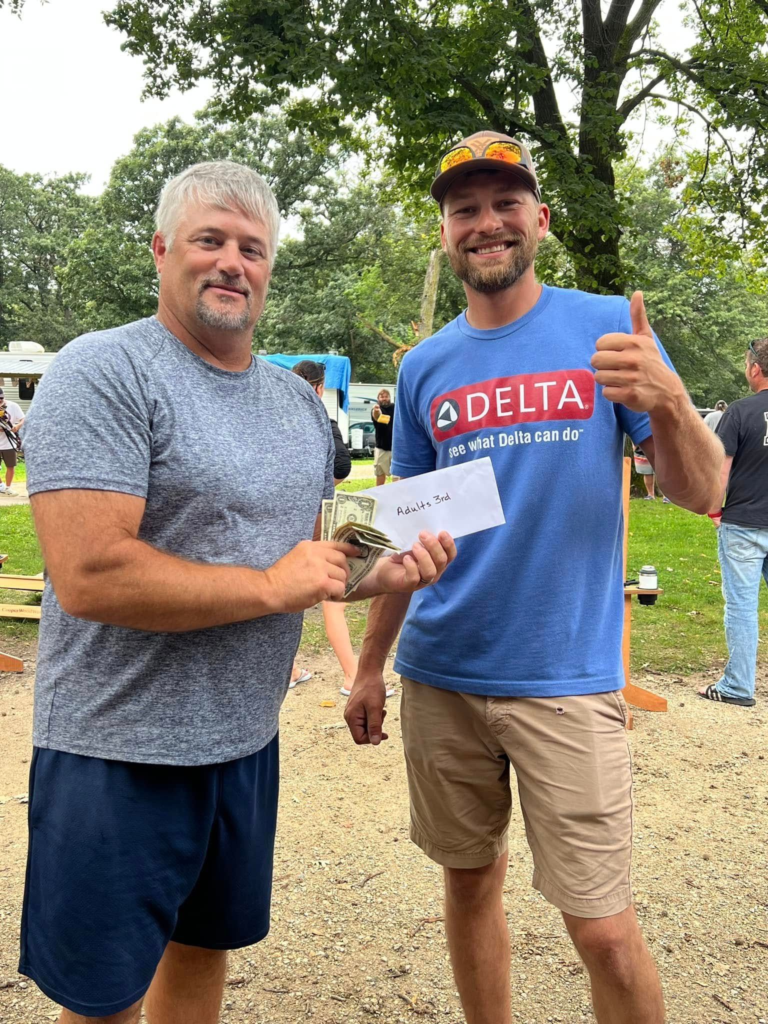 Two men are standing next to each other.