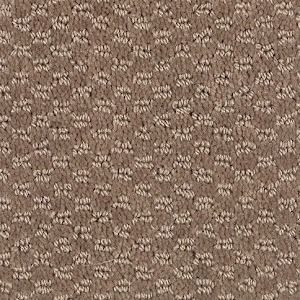 Beige carpet with a patterned, textured surface.