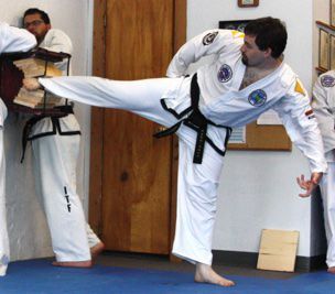 Practicing martial arts.