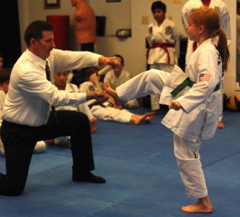 A kid doing martial arts.