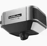A modern, silver and black LiftMaster garage door opener unit with an integrated camera at the bottom.