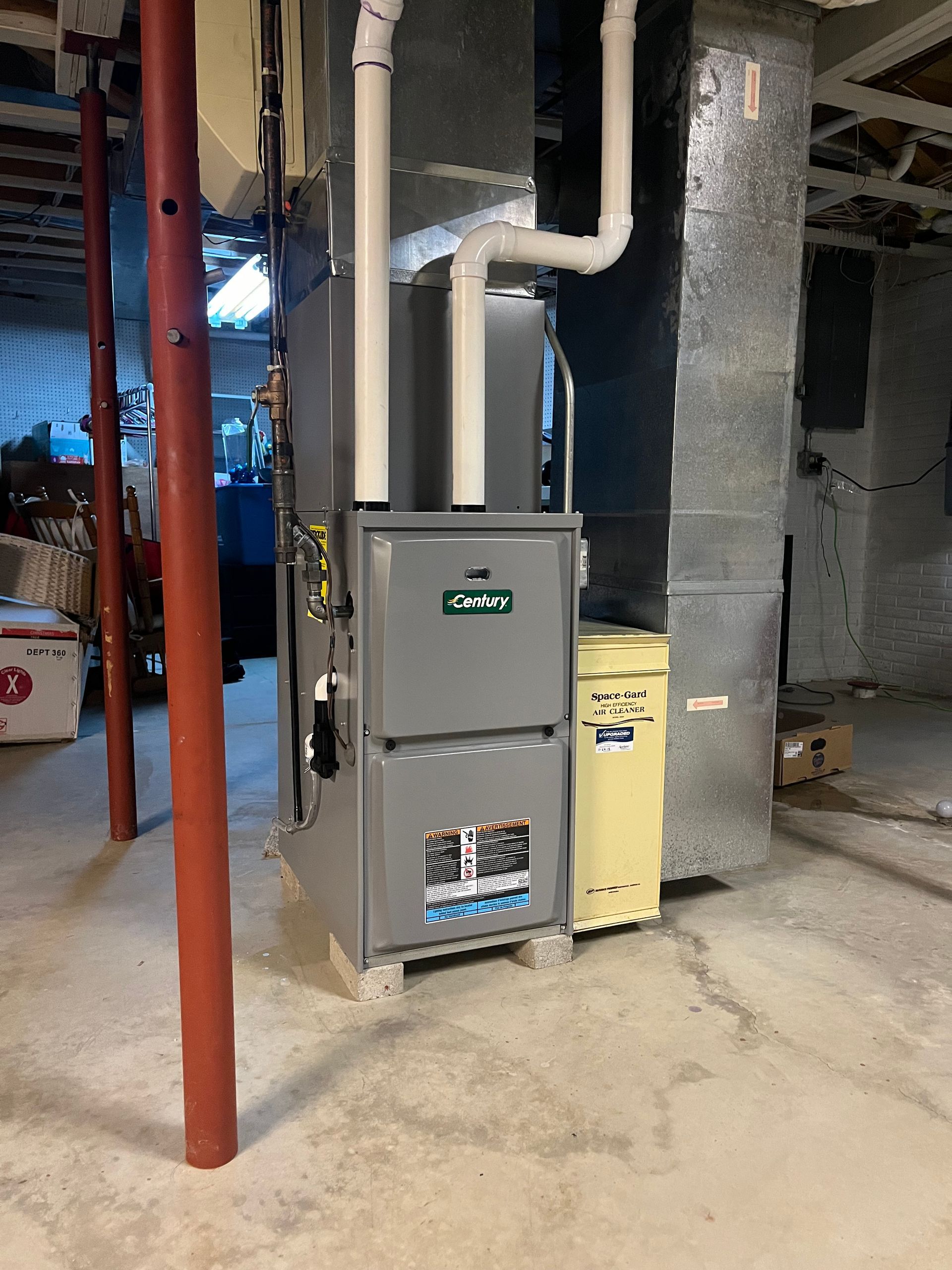 A heating and cooling system is installed in a basement.