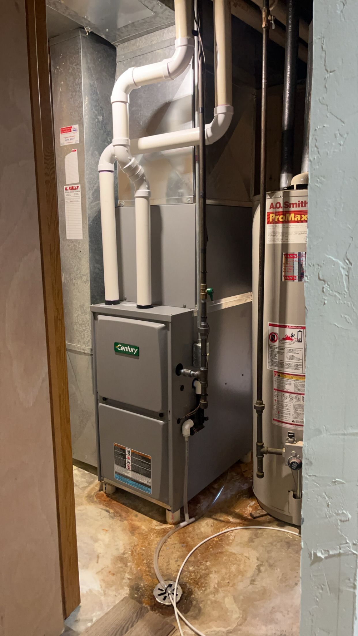 A picture of a heating and cooling system in a basement.