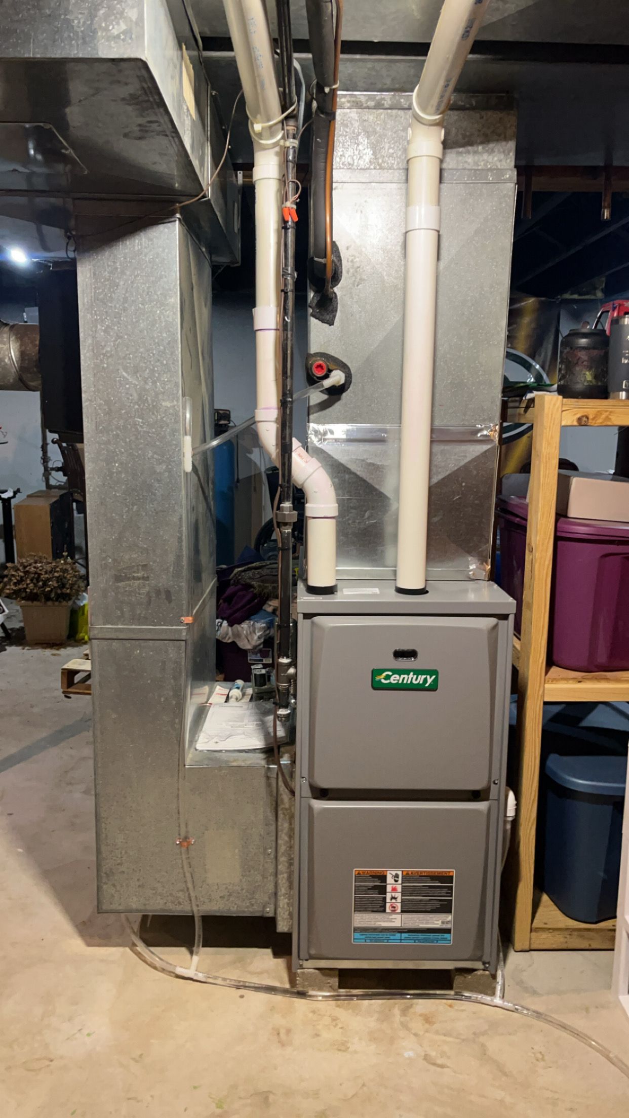 A heating and cooling system is installed in a basement.